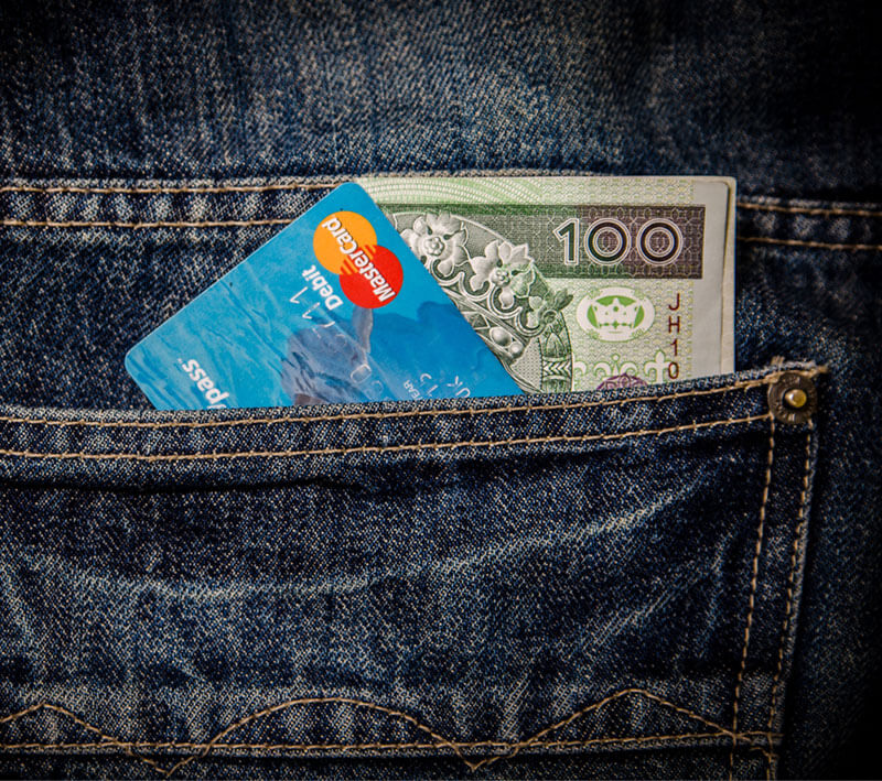 Credit card and cash inside a pocket